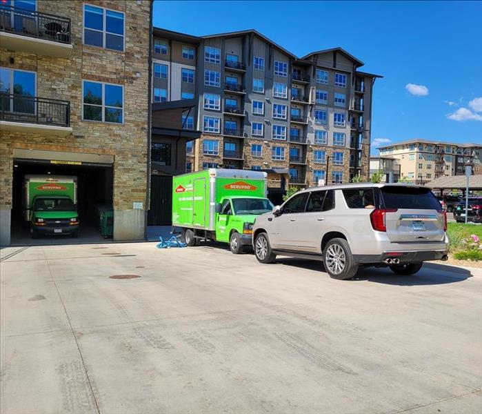 SERVPRO trucks parked outside apartment comples